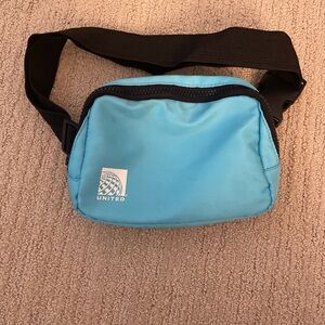 Teal blue Blue and black United Airlines fanny pack bag